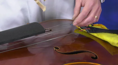 Luthier sets up and adjusts the easel Stock Footage 61914887