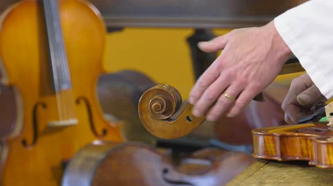 The luthier sets up four key strings Video stock 61914894