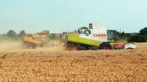 Lutsk, Ukraine - August 5,2020: Two modern combine harvesters with rotor Stock Footage 156574565