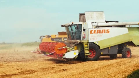 Lutsk, Ukraine - August 5,2020: Two modern combine harvesters with rotor Stock Footage 156574861