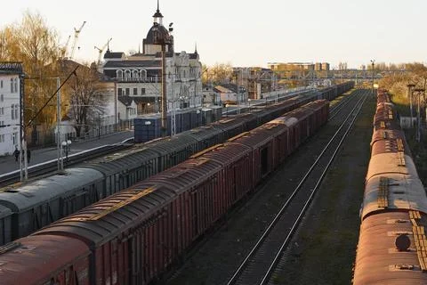 Lutsk, Ukraine - May 26,2021: Roofs of cargo train with shipping container in Stock Photos