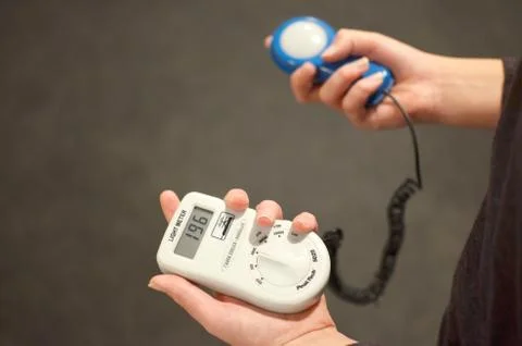 Lux meter for measuring light intensity in hand Stock Photos