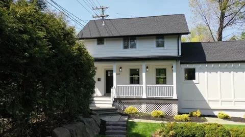 LUX Tiny White Home Black Roof Video stock 263456463