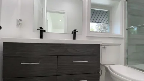 LUX Tiny White Home Blue Fireplace Black and White Shower Head Video stock 263456340