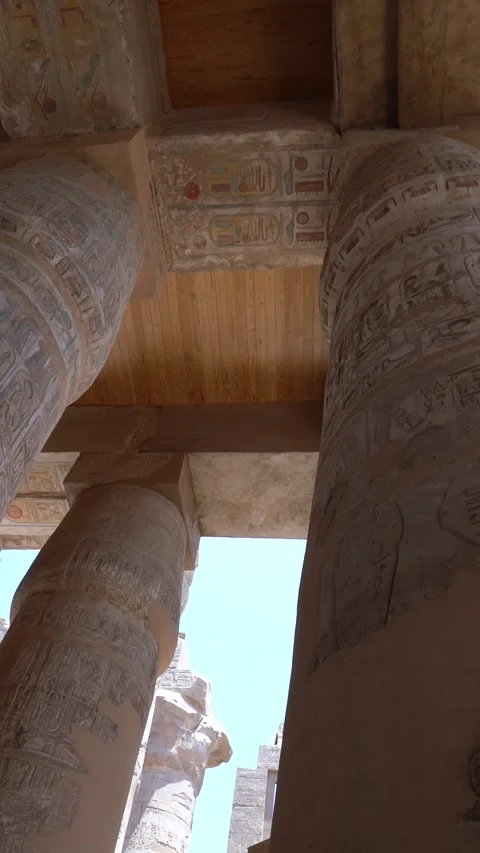 Luxor, Egypt -MARCH 10, 2026: Colossal egyptian columns with hieroglyphs at Stock Footage 331120326