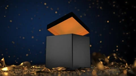 A luxurious black gift box opens magically as the gold ribbon unravels and .. Stock Footage 296501667