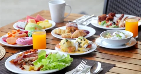 Luxurious breakfast table outdoor setting with fresh juice, eggs Stock Footage 312002439