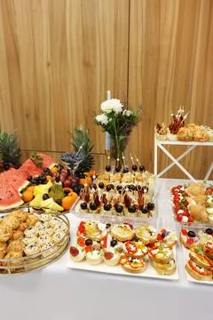 Luxurious buffet with fruit, cheese, canapes, pastries and appetizers arrange 스톡 사진