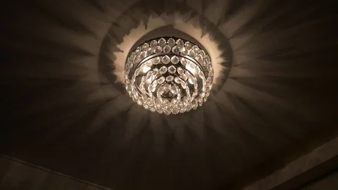 Luxurious Chandelier Throwing Shadows At The Ceiling Stock Footage 95761670