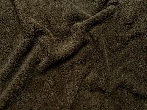 Luxurious chocolate brown fleece texture softly folding with tactile ripples  Stock Photos