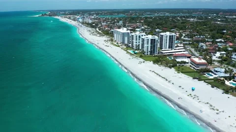 Luxurious Condominiums Overlooking Teal Waters on a Sunny Day Vídeos de archivo 336701279