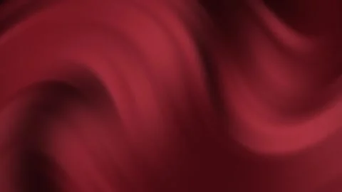 Luxurious deep red silk swaying gently in the breeze creates a smooth Stock Footage 321608991