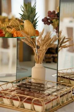 A luxurious dessert table setup featuring an array of fresh fruits, chocolate Fotos de archivo