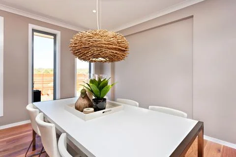 Luxurious dinning room table set up with chairs and decoration Foto stock