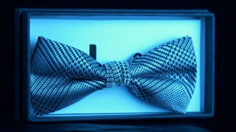 Luxurious geometric pattern silk in retail box- diamond blue light 4k Stock Footage 98403897