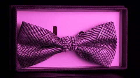 Luxurious geometric pattern silk in retail box -  purple light 4k Stock Footage 98404843