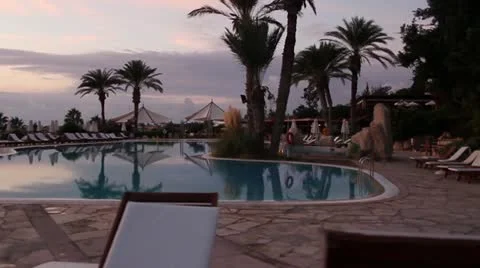 Luxurious hotel pool at sunset Stock-Footage 20588720