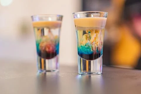 A luxurious image showcases two captivating cocktails with layered effects,.. Stock Photos