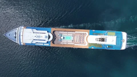 Luxurious large cruise ship sailing in calm blue waters aerial view Stock Footage 299868436