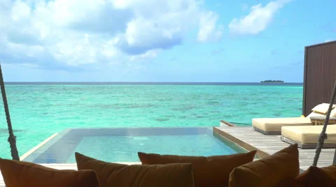 Luxurious ocean villa terrace with private pool and daybeds Stock Footage