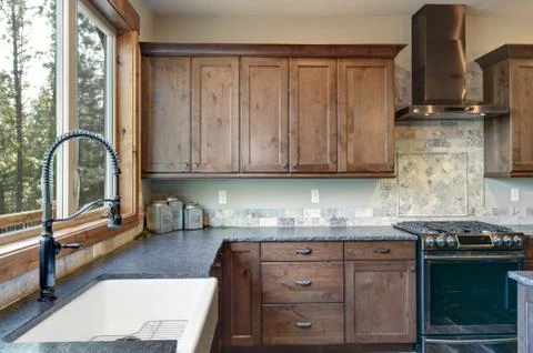 Luxurious open plan kitchen design with granite counter tops and stainless st Stock Photos
