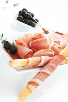 Luxurious prosciutto ham background. Stock Photos