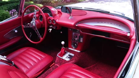 The luxurious red interior of a vintage Corvette Stock Footage 325051406