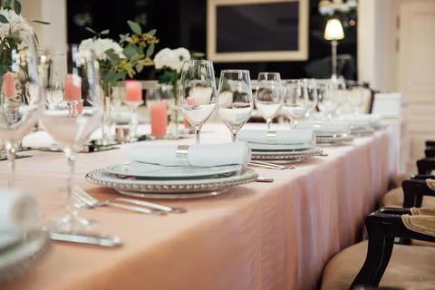 Luxurious restaurant. Luxurious interior, white tables, serving dishes and Stock Photos