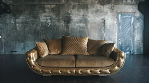 Luxurious sofa in a modern interio. In dark tones and shades of gold Stock Footage 91511809