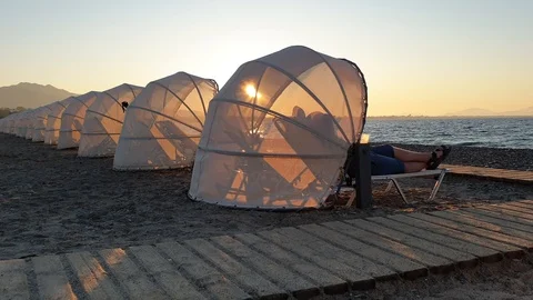 Luxurious sunshaders on the beach Stock Footage 117280605