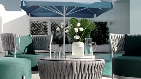 Luxurious table and chairs without people in a Mediterranean open-air restaurant Stock Footage 220772184