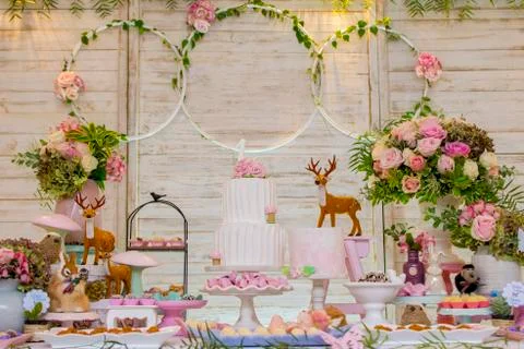 Luxurious table of sweets and birthday cake Stock Photos