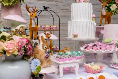 Luxurious table of sweets and birthday cake Stock Photos
