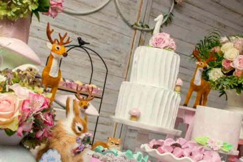 Luxurious table of sweets and birthday cake Stock Photos