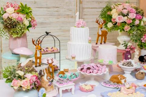 Luxurious table of sweets and birthday cake Stock Photos