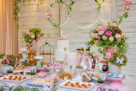 Luxurious table of sweets and birthday cake Stock Photos