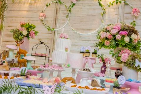 Luxurious table of sweets and birthday cake Stock Photos