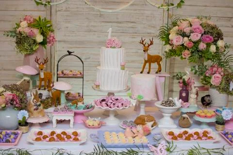 Luxurious table of sweets and birthday cake Stock Photos