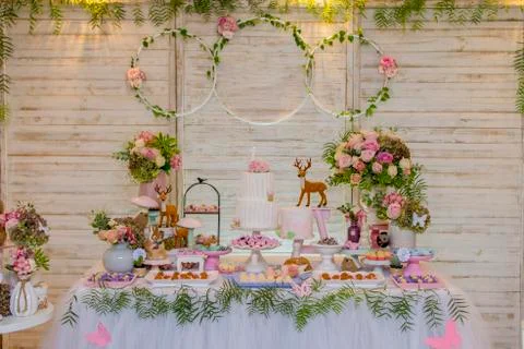 Luxurious table of sweets and birthday cake Stock Photos
