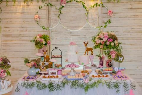 Luxurious table of sweets and birthday cake Stock Photos