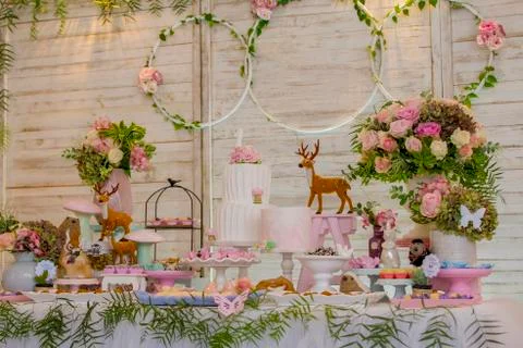 Luxurious table of sweets and birthday cake Stock Photos
