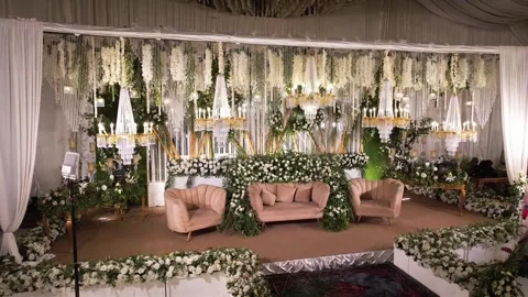 Luxurious Wedding Ceiling Decor with Golden Chandeliers and Floral Arrangements Stock Footage 345270175
