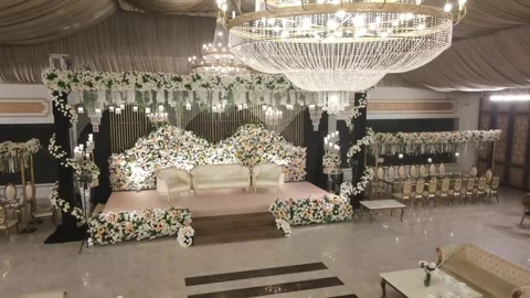 Luxurious wedding stage decor , interior, before receiption, ariel wide shot pas Stock Footage 259795819