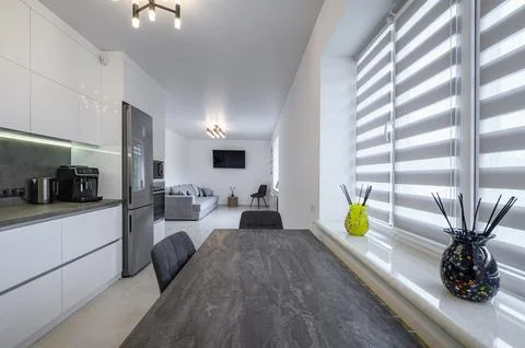 Luxurious white kitchen with granite counter top Stock Photos