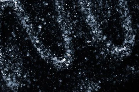 Luxury Abstract Glitter Texture with Bubbles on Deep Black Background Stock Photos