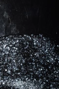 Luxury Abstract Glitter Texture with Bubbles on Deep Black Background Stock Photos