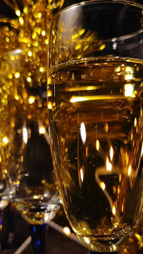 Luxury and elegance vertical background: Champagne bubbles on a glass Stock Footage 294760723