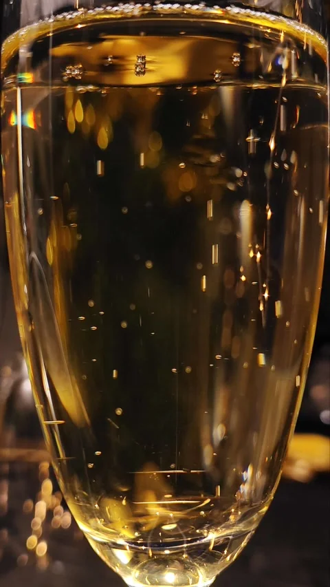 Luxury and elegance vertical background: Champagne bubbles on a glass Stock Footage 294760764