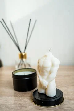 Luxury aroma lighting aromatic scented candle glass displayed on woden table Stock Photos