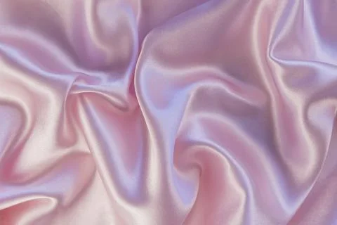 Luxury background design. Smooth texture of pink silk or satin. Can be used as Stock Photos
